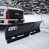 Detail K2 front hitch mounted snow plow attached to white truck plowng snow.