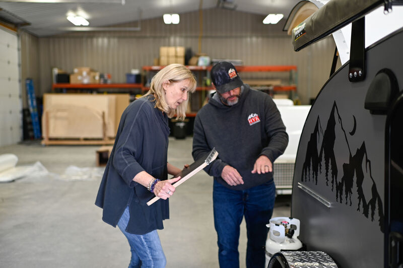 Customer Cindy Checking out her New Camper with Hyk Outdoors founder, Jeff