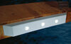 Taylor Made white dock edging attached to a boat dock. 