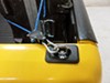 Erickson bull ring retractable anchor mounted in stake pocket of yellow truck.