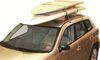 Malone sup foam block carrier holding 2 paddleboards on suv roof. 
