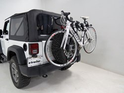Spare tire mounted bicycle carrier on Jeep Wrangler with bikes installed