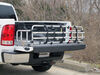 Topline fold down truck bed extender mounted in bed of white truck.