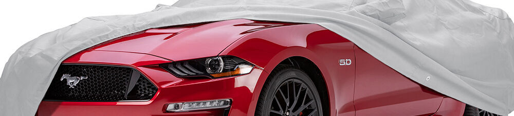 Covercraft cover covering red mustang.