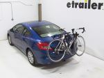 Trunk-mounted bicycle carrier with bike on a car