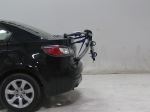 Trunk-mounted bicycle carrier with arms folded down
