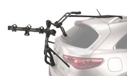 Trunk-mounted bicycle carrier mounted on SUV with a spoiler