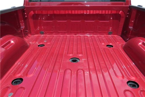 Five factory prep package pucks in red truck bed