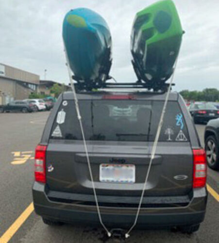Kayaks Secured to Vehicle with Bow/Stern Straps (back view)