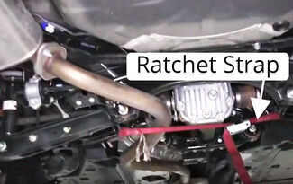 Ratchet strap on exhaust