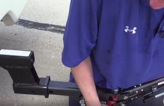 Inserting tow bar shank into hitch receiver image
