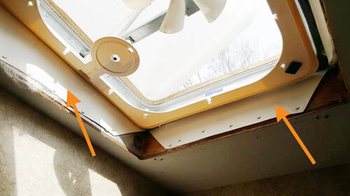 RV roof membrane stapled to inside of vent space