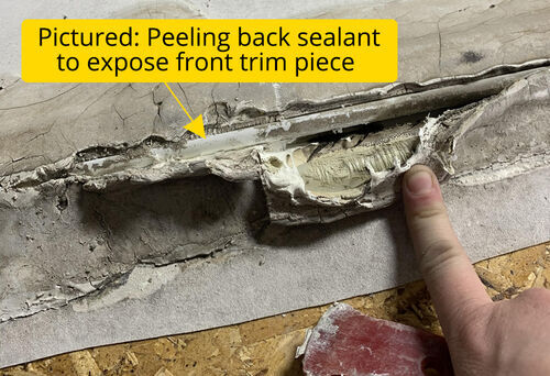 Peel back sealant to expose trim