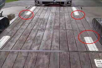 E-track installed over multiple planks on flatbed trailer