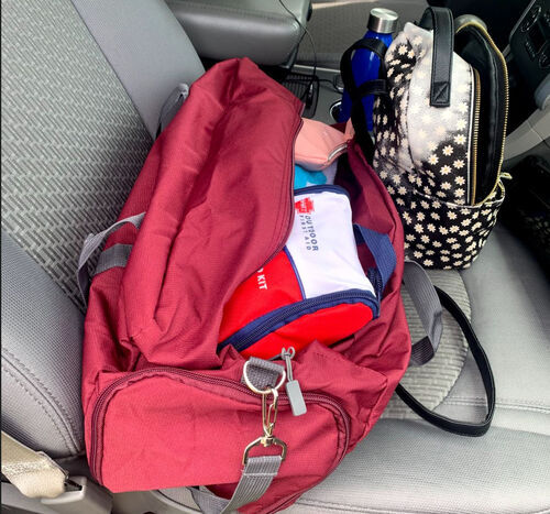 Duffel bag and backpack in front seat