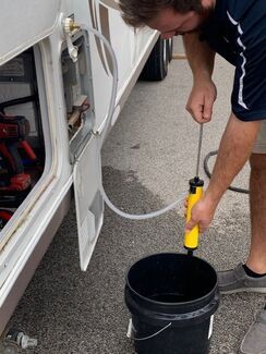 Pumping white vinegar into RV water heater with a winterization kit