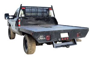Rear end view of a flatbed truck bed.
