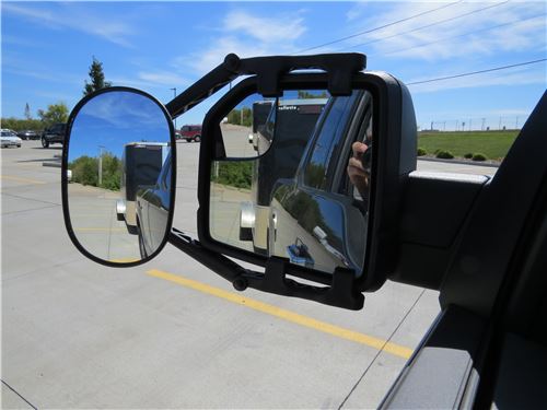 Towing mirror attached to OEM mirror on vehicle.