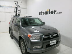 Malone roof-mounted bicycle carrier on sedan with bike