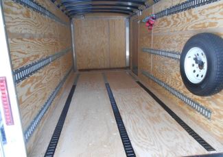 E-track mounted on walls of enclosed trailer
