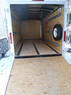 E-Track on Floors and Wall of Enclosed Trailer with Tire on Wall