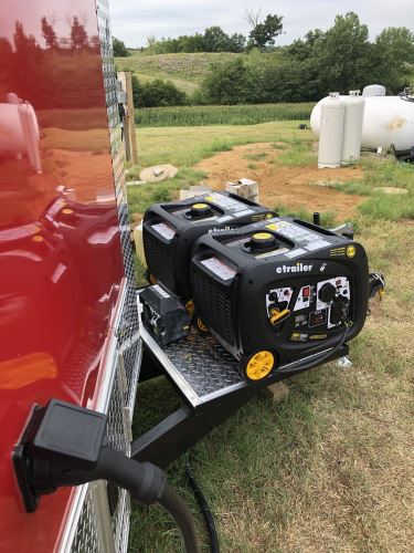 Image of two portable generators on a trailer tongue