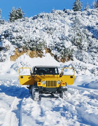 Yellow Jeep in Snow