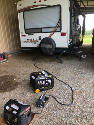 Camper connected to portable generator parallel kit image
