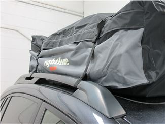 Roof cargo bag secured to side rails