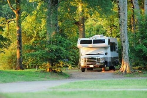 RV in the scenic woods during sunrise