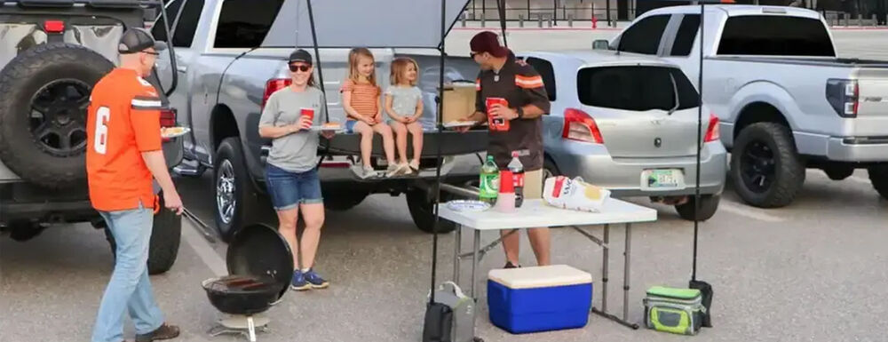 Family Enjoying Tailgate Party in Parking Lot