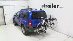 Thule hitch-mounted bicycle carrier installed on Nissan Xterra with bike loaded
