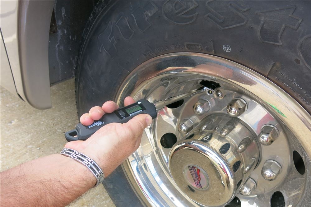 Tire Pressure Being Checked