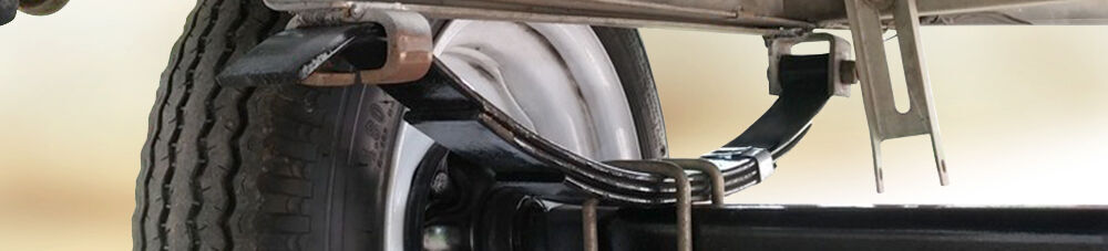 close up of trailer leaf spring suspension. 