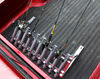 Viking Solutions 2-in-1 truck fishing road carrier in back of red truck holding fishing rods. 