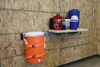 E-Track on Wall Supporting Shelf with Supplies