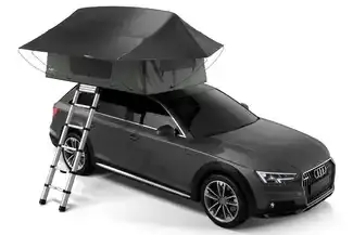 Black tent on roof of black car