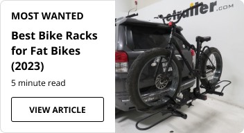 A fat tire bike on a bike rack.